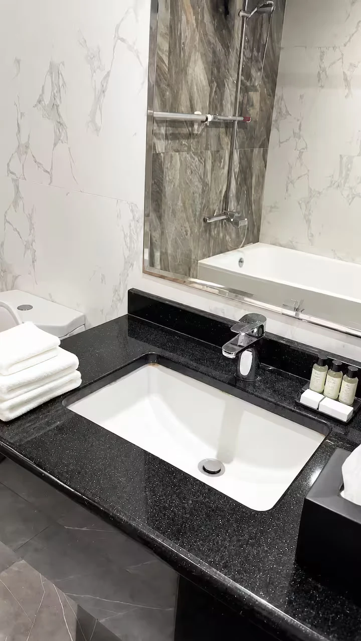 Marble bathroom vanity and bathtub